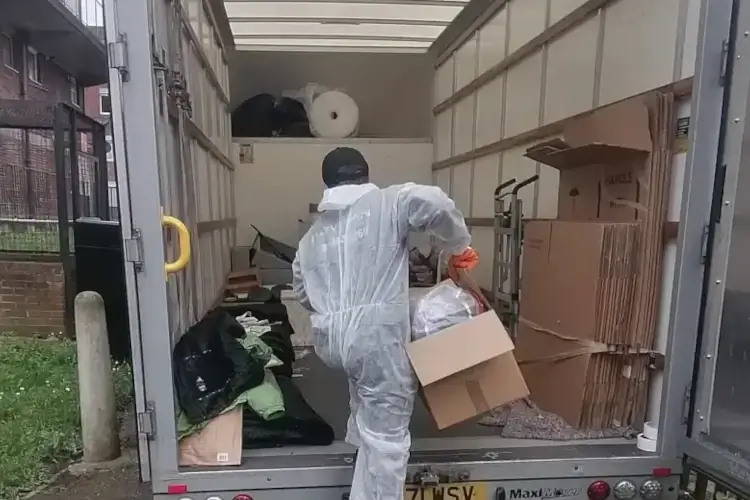 Worker completing probate house clearance Worker completing probate house clearance